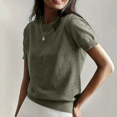 Elegant women's short sleeve knit sweater in soft white for spring & summer fashion.