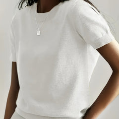 Modern women's short sleeve sweater, a versatile knit top for any occasion.