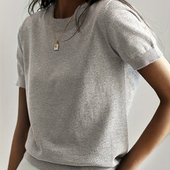 Classic women's short sleeve knit top, offering an elegant and comfortable fit.