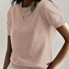 Fashionable women's short sleeve knit sweater, offering both comfort and style.