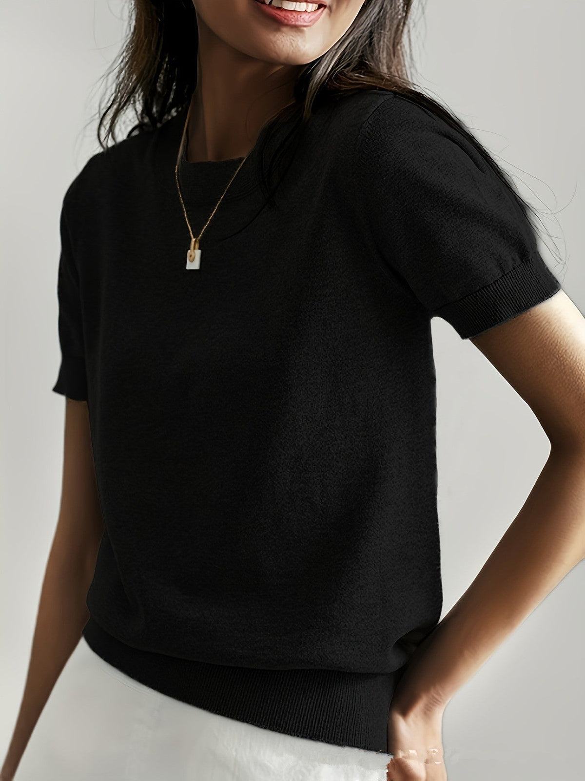 Premium women's short sleeve knit sweater, combining elegance with everyday comfort.