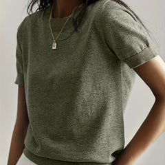 Breathable women's short sleeve knit sweater, perfect for summer comfort and style.